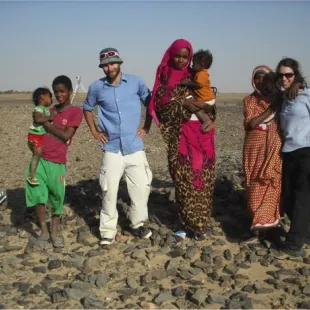 Nearby residents visiting members of the archaeological team – in the picture Jens and Gemma – at the Kerma burial site near the village of Karmel (photo: Gareth Rees)